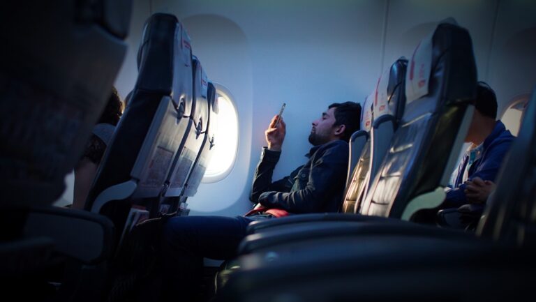 Traveler using smartphone airport wi-fi