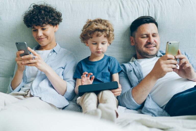 Family using home control touch screen