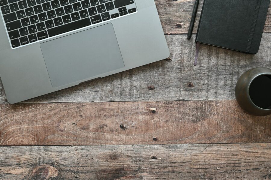 Thin laptop wooden desk open notebook computer coffee
