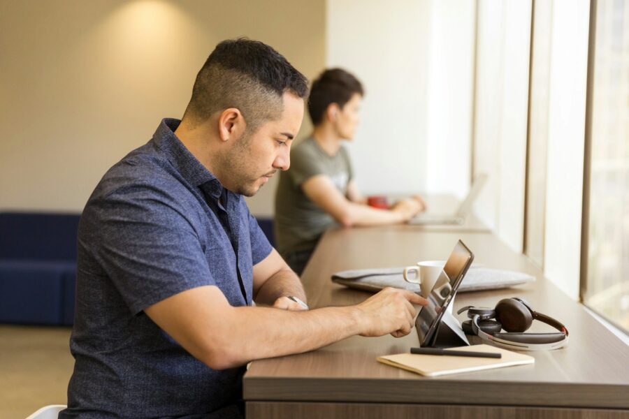 Student using android tablet desk