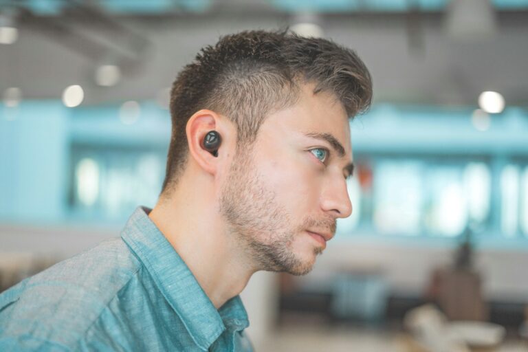 Wireless earbuds noise cancelling case person wearing over