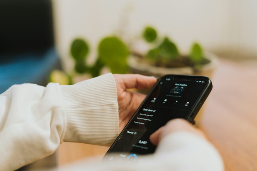 Person using voice assistant front soundbar