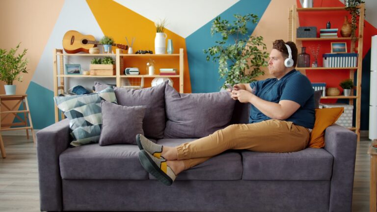 Person using wall switch home scene
