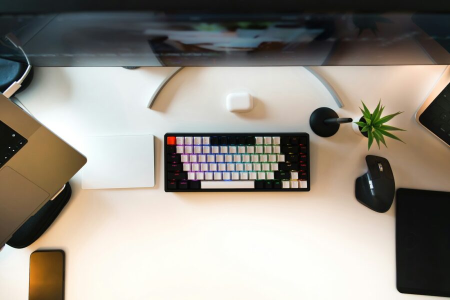 Person working laptop ipad desk