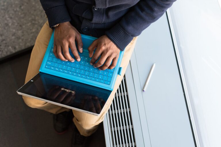 Person typing tablet