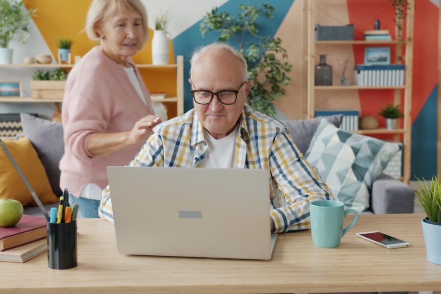 Family using laptop living room table