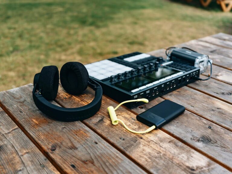 Portable media player headphones wooden table