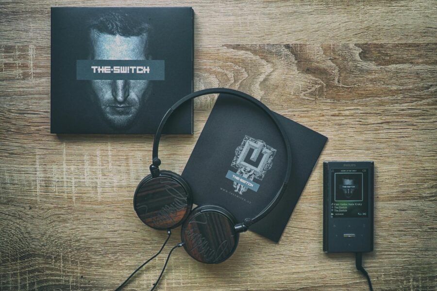 Portable media player headphones wooden table