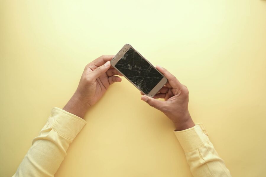 Smartphone drop test cracked screen concrete floor